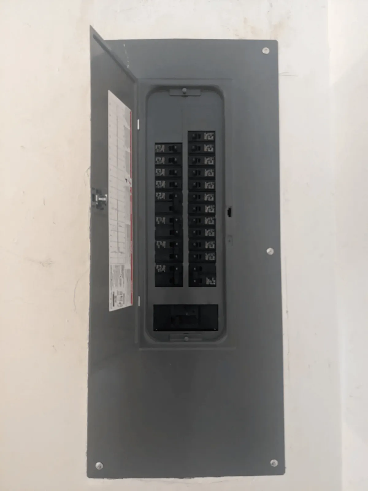 Newly installed residential breaker panel with neatly organized circuits