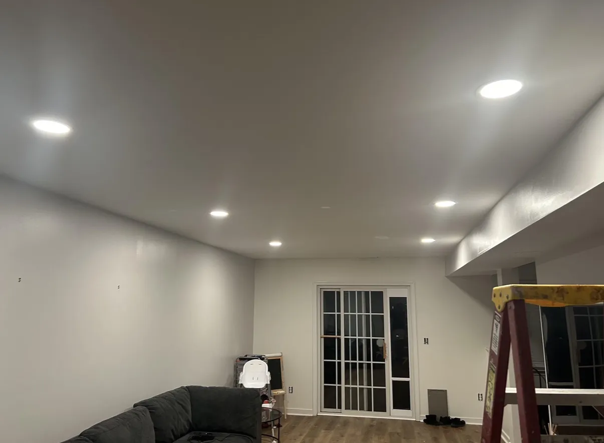 Recessed LED pot lights installed in a living room ceiling