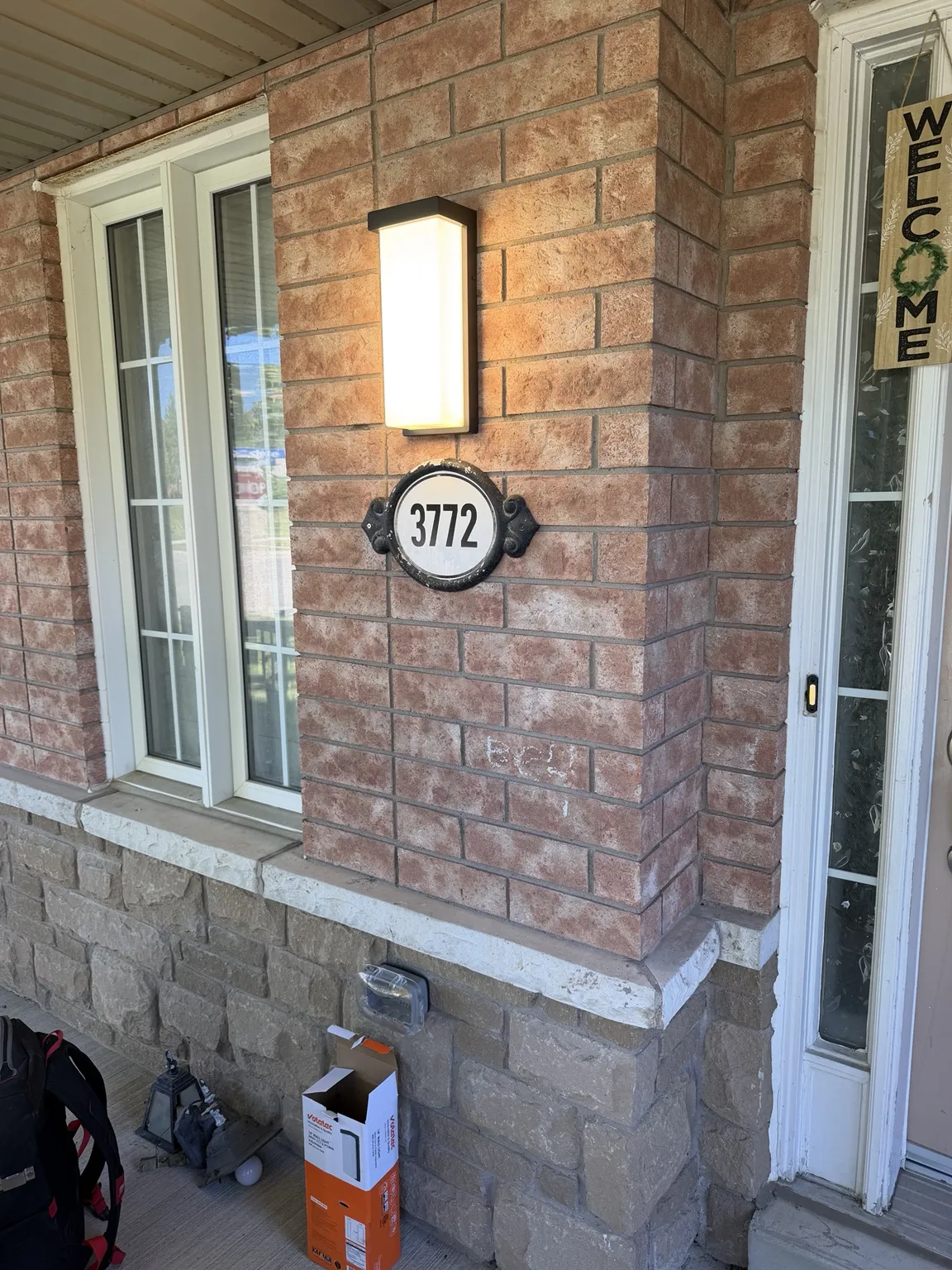 Outdoor wall lantern installed on a brick exterior