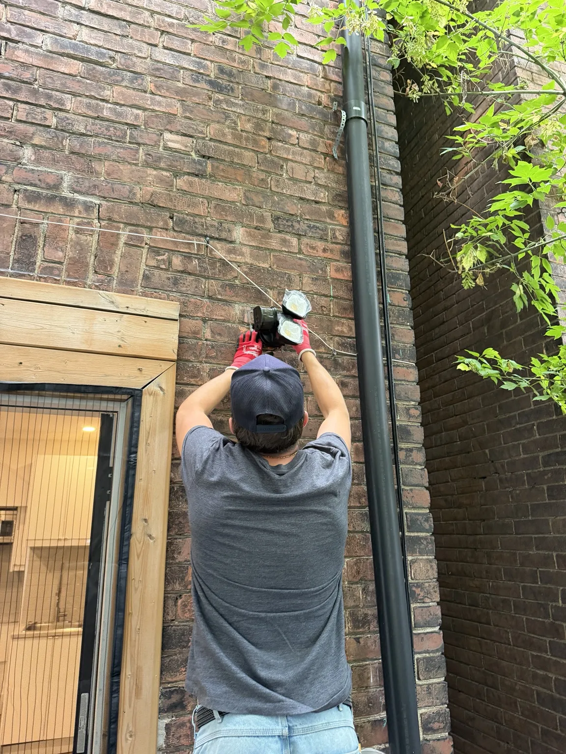 Exterior electrical installation on a brick wall