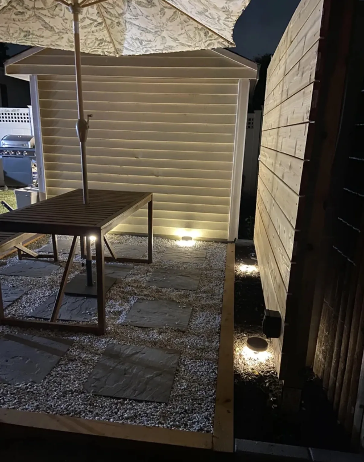 Patio and backyard lighting installed around an outdoor seating area